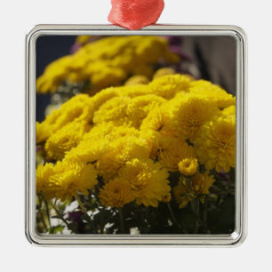 Yellow marigolds bask in sunlight metal ornament