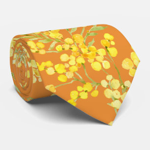 Yellow mimosa flowers on orange tie