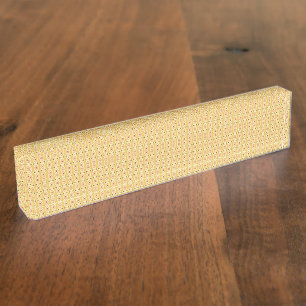 Yellow, orange, and brown sheets of wrapping paper nameplate