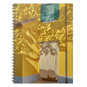 Yellow painted concreted building notebook