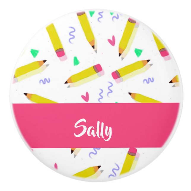 Yellow pencils and scrabbles on white ceramic knob (Front)
