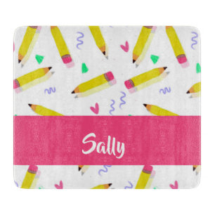 Yellow pencils and scrabbles on white cutting board