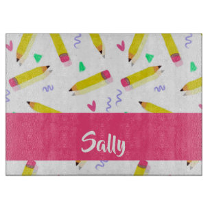 Yellow pencils and scrabbles on white cutting board