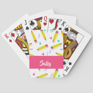 Yellow pencils and scrabbles on white playing cards