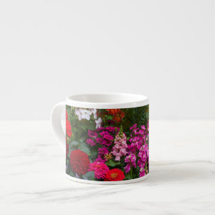 Yellow picket fence with flower garden in espresso cup