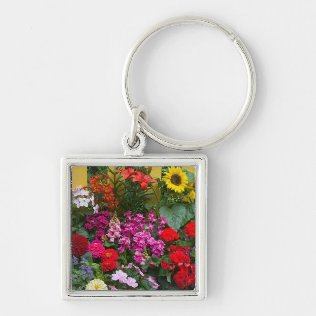 Yellow picket fence with flower garden in key ring (Front)