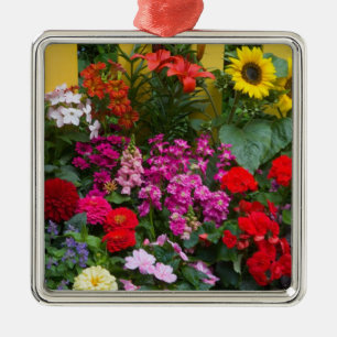 Yellow picket fence with flower garden in metal tree decoration