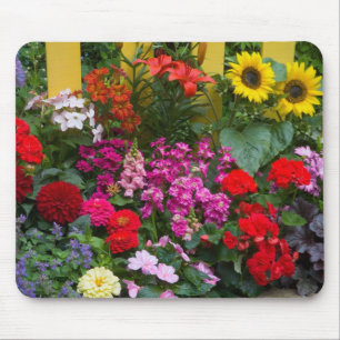 Yellow picket fence with flower garden in mouse pad