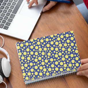 Yellow polka dot geometric pattern on blue notebook