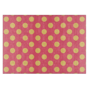 Yellow polka dots on coral cutting board