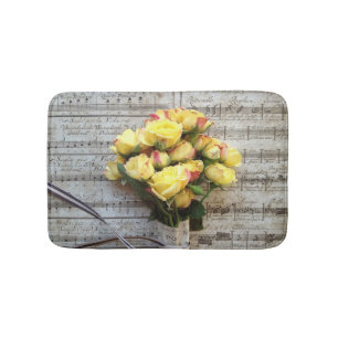 Yellow roses on old music bath mat