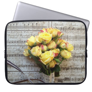 Yellow roses on old music laptop sleeve