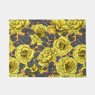 Yellow roses with grey leaves on orange doormat