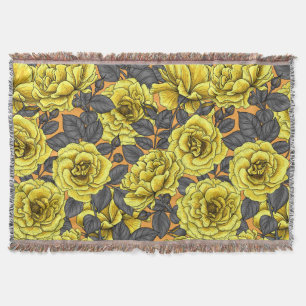 Yellow roses with grey leaves on orange throw blanket
