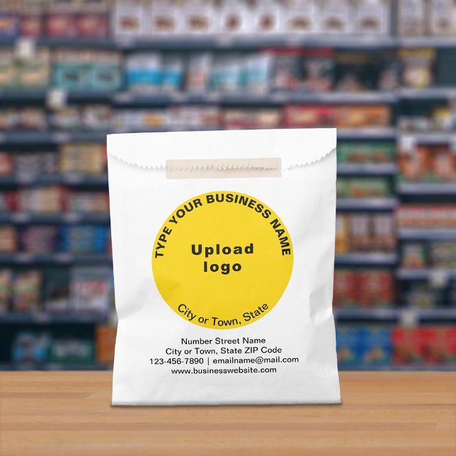 Yellow Round Business Brand on Paper Bag (Paper bag with yellow round business branding displayed in a store)