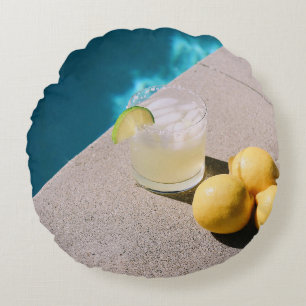Yellow round fruits on grey table cushion
