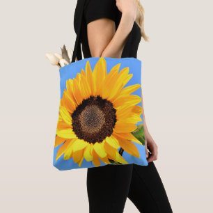 Yellow Sunflower Against Sun on Blue Sky Tote Bag