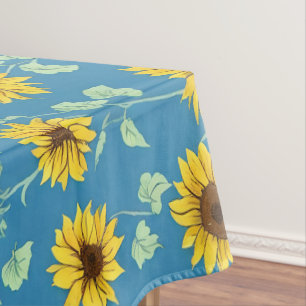 Yellow sunflowers green leaves blue background tablecloth