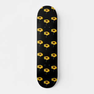 Yellow sunflowers on black skateboard