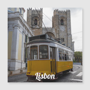 Yellow tram on Lisbon Cathedral in Portugal
