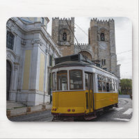 Yellow tram on Lisbon Cathedral in Portugal