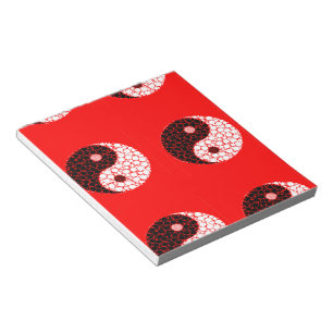 Ying yang circles on red notepad