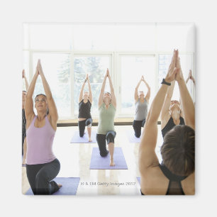 Yoga instructor leading class through the magnet