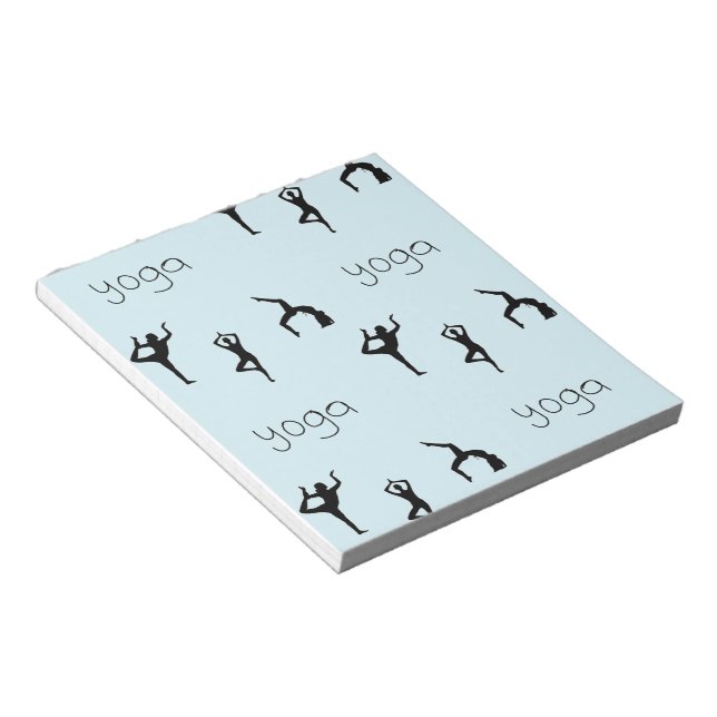 Yoga poses and text pattern on blue notepad (Angled)