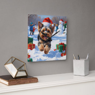 Yorkipoo Running in Snow with Christmas Hat Square Wall Clock