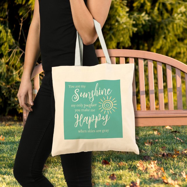 You Are My Sunshine Make Me Happy Teal Blue Sun Tote Bag (You Are My Sunshine You Make Me Happy song lyrics on a teal blue background with yellow sun tote bag)