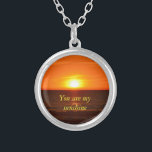 You are my sunshine necklace<br><div class="desc">This lovely quote along with this picture of the sunset that I took, will win her/his heart.</div>