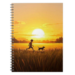 Young boy running with dog at sunset notebook