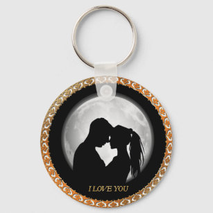 Young couple black silhouette kissing one another key ring