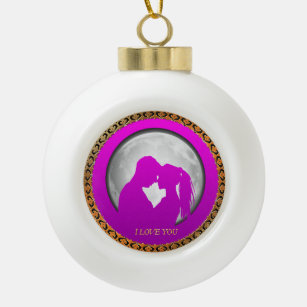 Young couple pink silhouette kissing one another ceramic ball christmas ornament