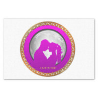 Young couple pink silhouette kissing one another