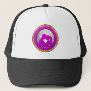 Young couple pink silhouette kissing one another trucker hat