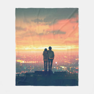 young couple standing on the roof top looking at c fleece blanket
