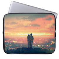 young couple standing on the roof top looking at c