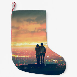 young couple standing on the roof top looking at c small christmas stocking