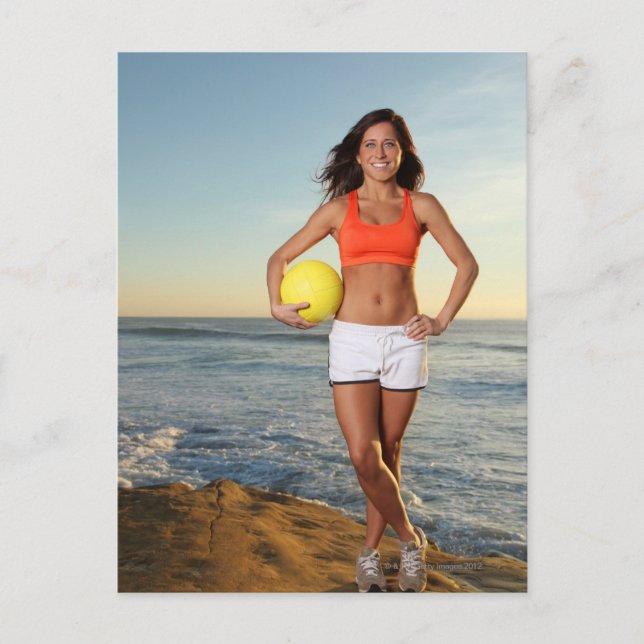 young fit pretty female holding a volleyball at postcard (Front)