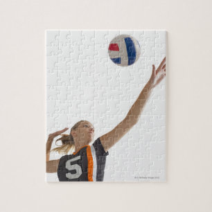 Young girl (16-17) playing volleyball jigsaw puzzle