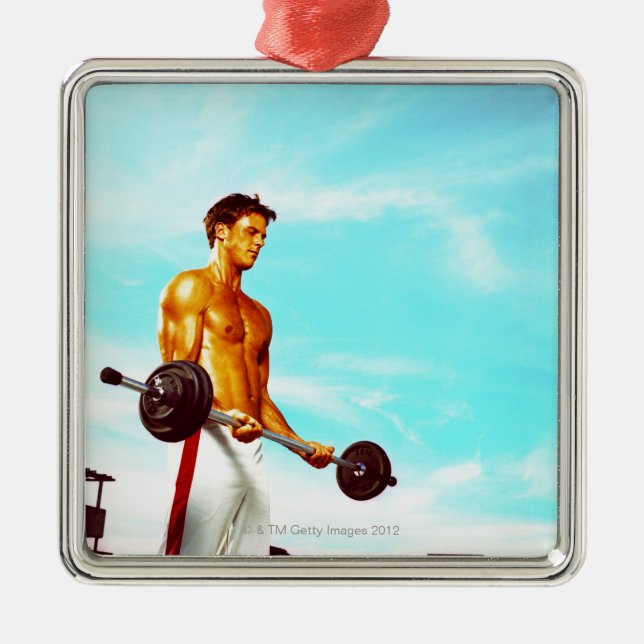 Young man exercising with barbells metal tree decoration (Front)