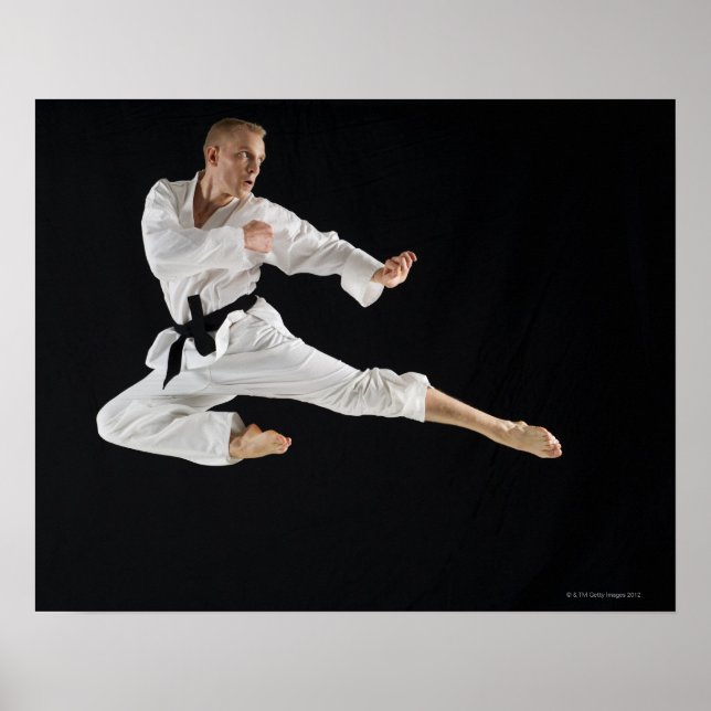 Young man performing karate kick on black poster (Front)