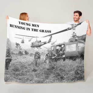 YOUNG MEN RUNNING IN THE GRASS FLEECE BLANKET