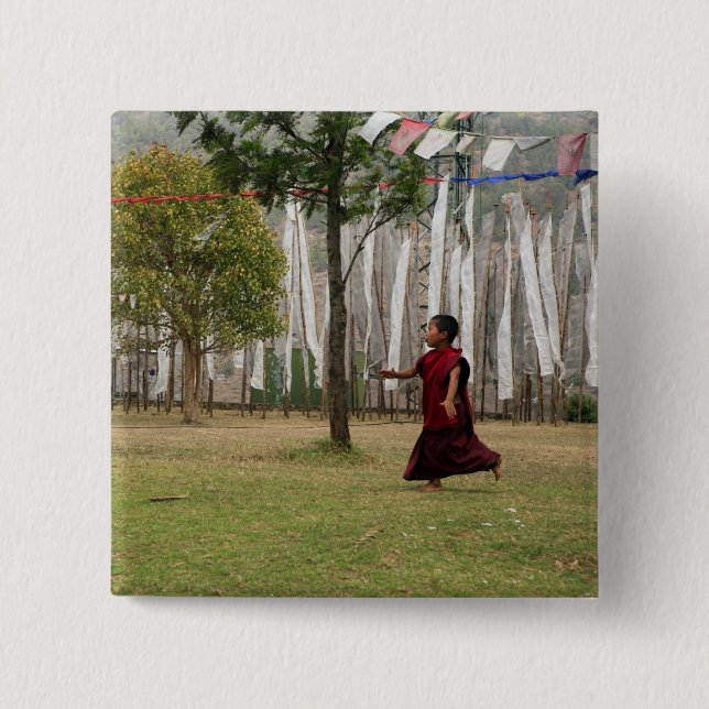 Young monk and prayer flags 15 cm square badge (Front)