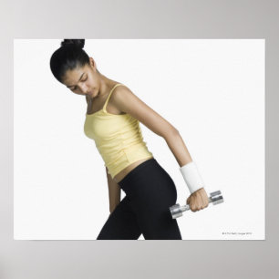 Young woman exercising with a dumbbell poster