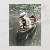 Young Woman in a Canoe with a Camera