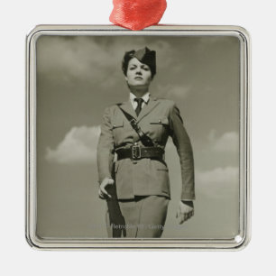 Young woman in military marching on rooftop metal ornament