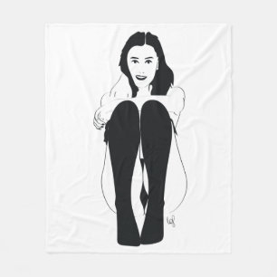 Young woman sitting fleece blanket