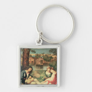 Youth with a guitar and two girls sitting key ring
